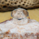 Navajo round multistone inlay ring, featuring a circular arrangement of natural stones set in a handcrafted sterling silver band with traditional Southwestern-inspired craftsmanship.  Underside view.