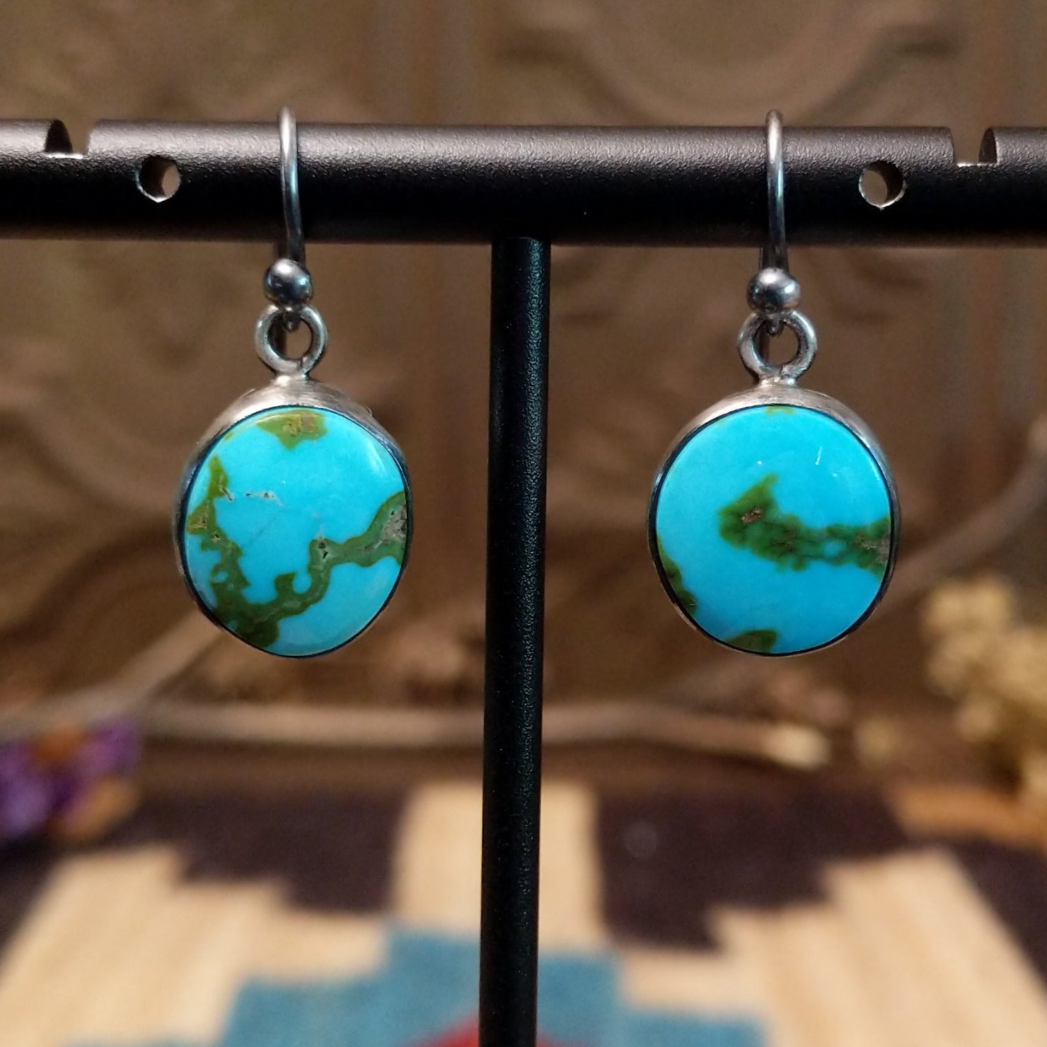 Sterling silver earrings with Sonoran gold turquoise set in round bezels.