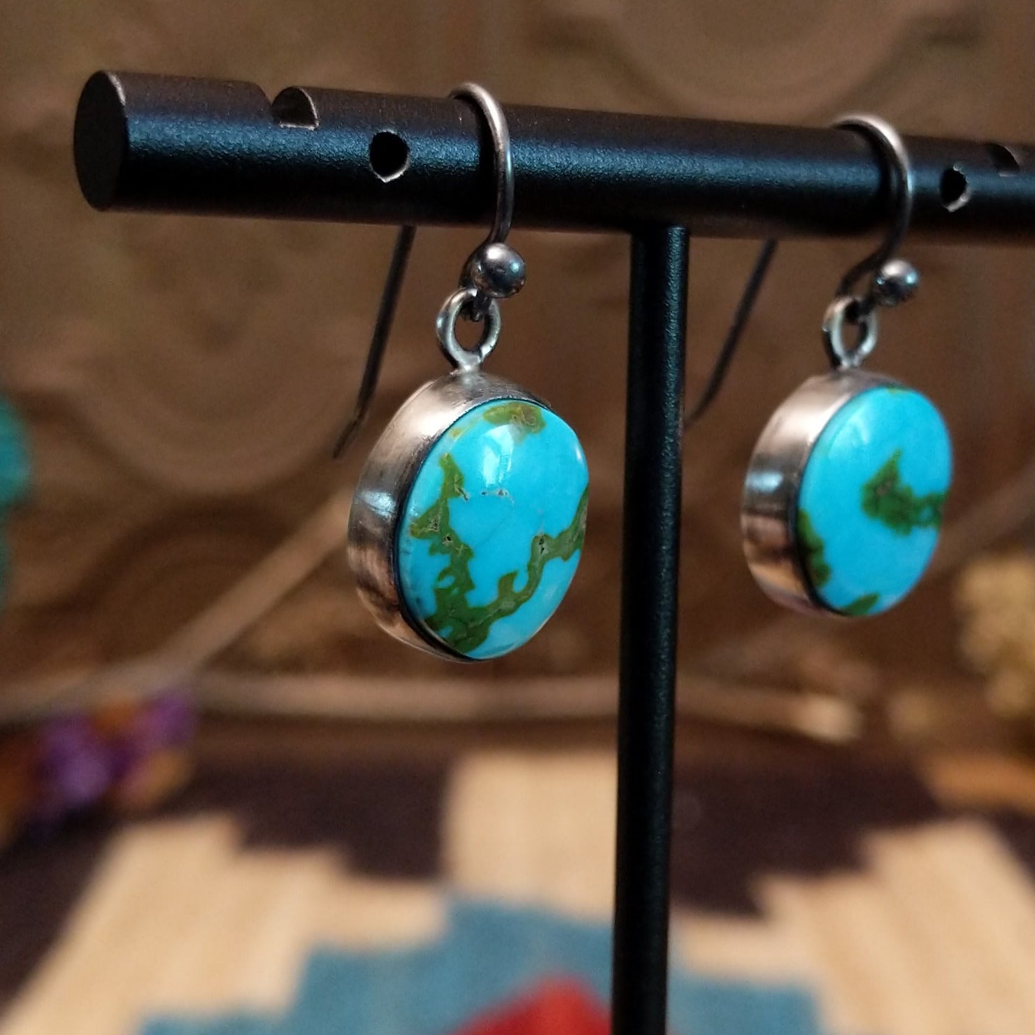 Sterling silver earrings with Sonoran gold turquoise set in round bezels.