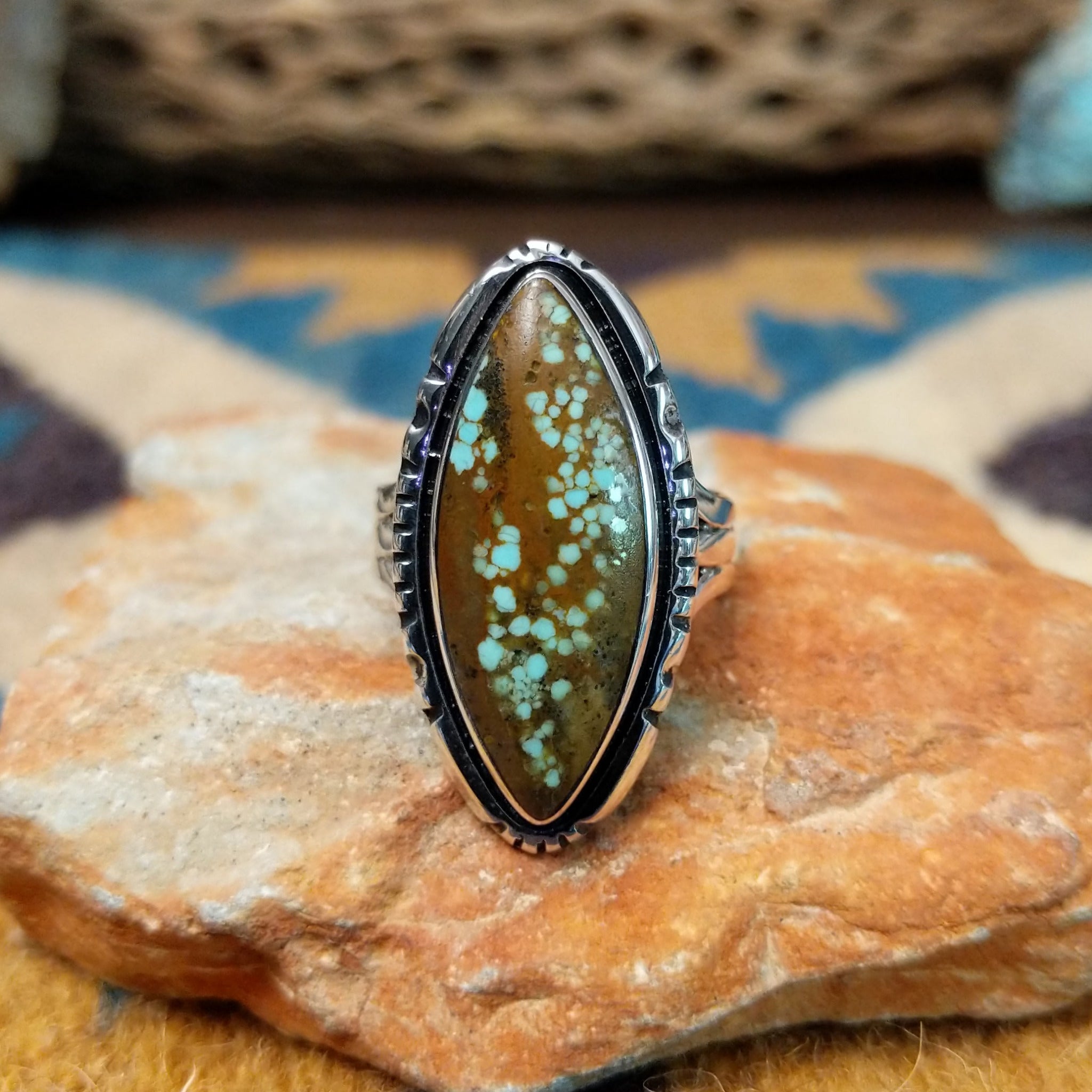 Handcrafted sterling silver Navajo Royston turquoise navette ring by K., featuring a natural Royston turquoise gemstone with brown matrix in a classic navette setting.