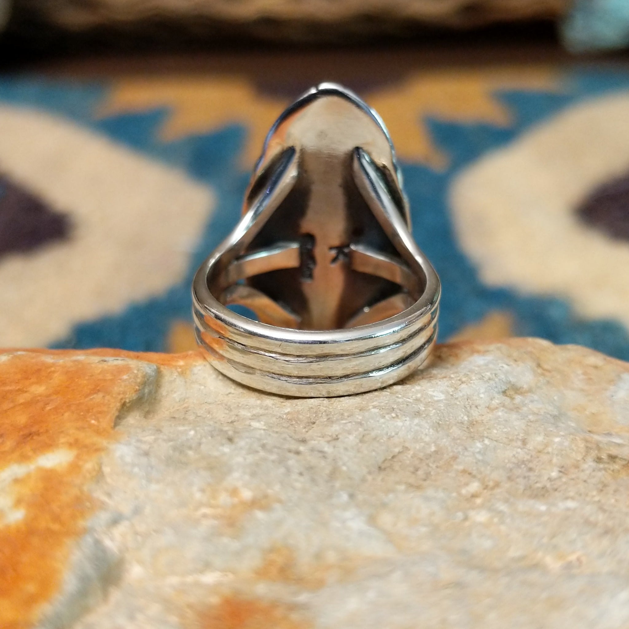 Handcrafted sterling silver Navajo Royston turquoise navette ring by K., featuring a natural Royston turquoise gemstone with brown matrix in a classic navette setting; underside view.