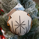 Sand painted ornament with traditional wedding vase motif.