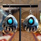 Sterling silver shadowbox bear paw earrings with turquoise set in notched bezels.