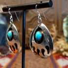 Sterling silver shadowbox bear paw earrings with turquoise set in notched bezels.