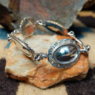 Navajo sterling silver concho bracelet with hand-stamped concho designs and traditional Southwestern detailing.