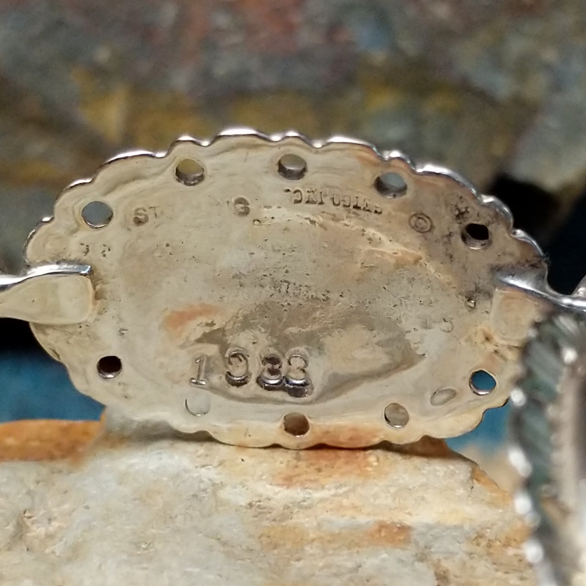Navajo sterling silver concho bracelet with hand-stamped concho designs and traditional Southwestern detailing; artisan and Sterling Silver stamp.