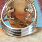 Close up of the artist's stamped signature