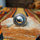 Authentic Navajo sterling silver dome ring with polished curved design. Features elegant silhouette suitable for everyday wear or special occasions. Size 8.5, measures approximately 0.75" L x 0.875" W, weighs approximately 0.2 oz.