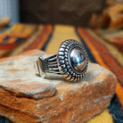Authentic Navajo sterling silver dome ring with polished curved design. Features elegant silhouette suitable for everyday wear or special occasions. Size 8.5, measures approximately 0.75" L x 0.875" W, weighs approximately 0.2 oz; side view.