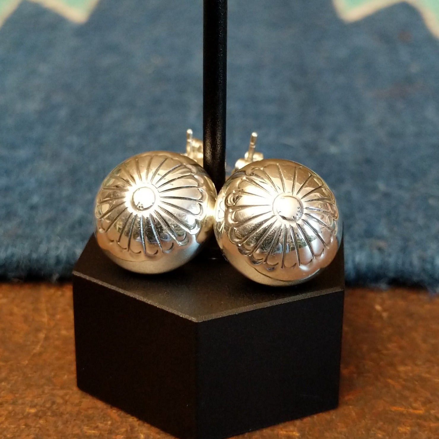 Dangle earrings with stud floral accents and chain.