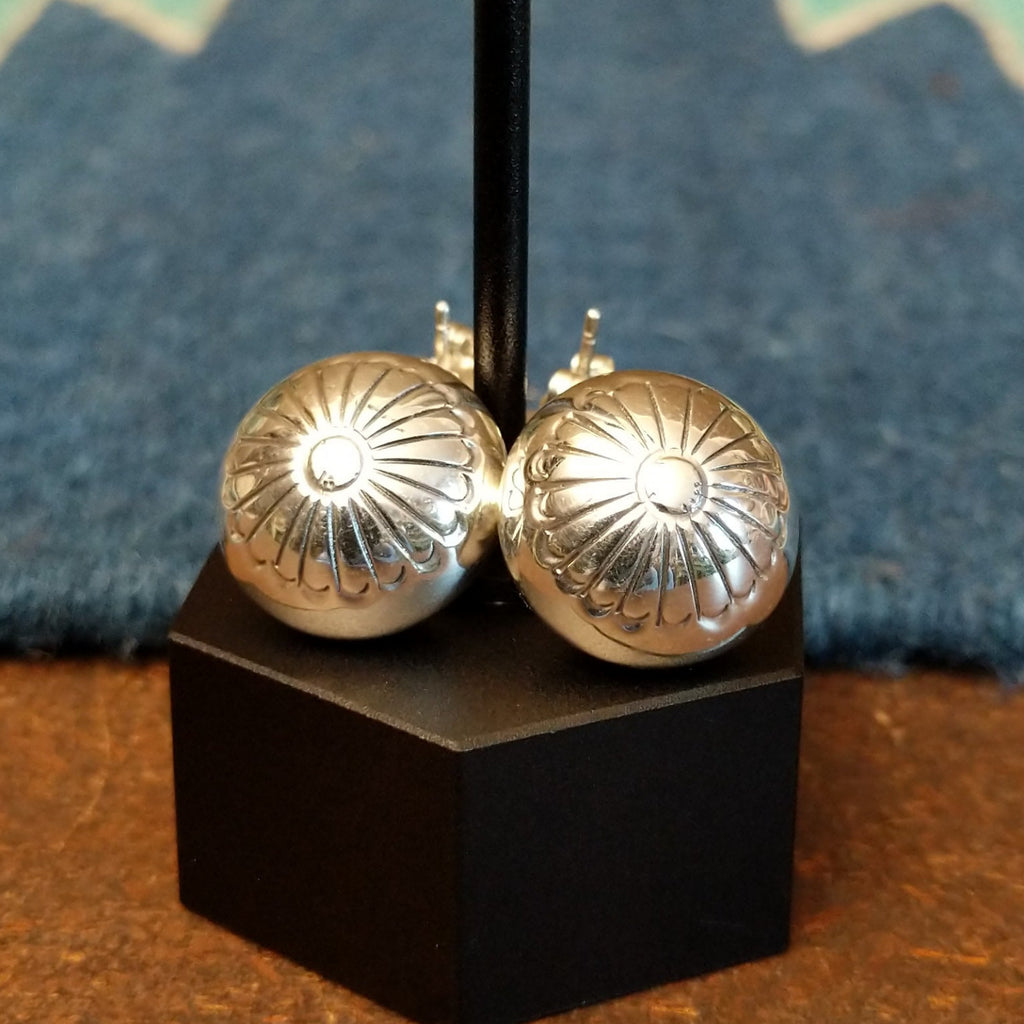 Dangle earrings with stud floral accents and chain.