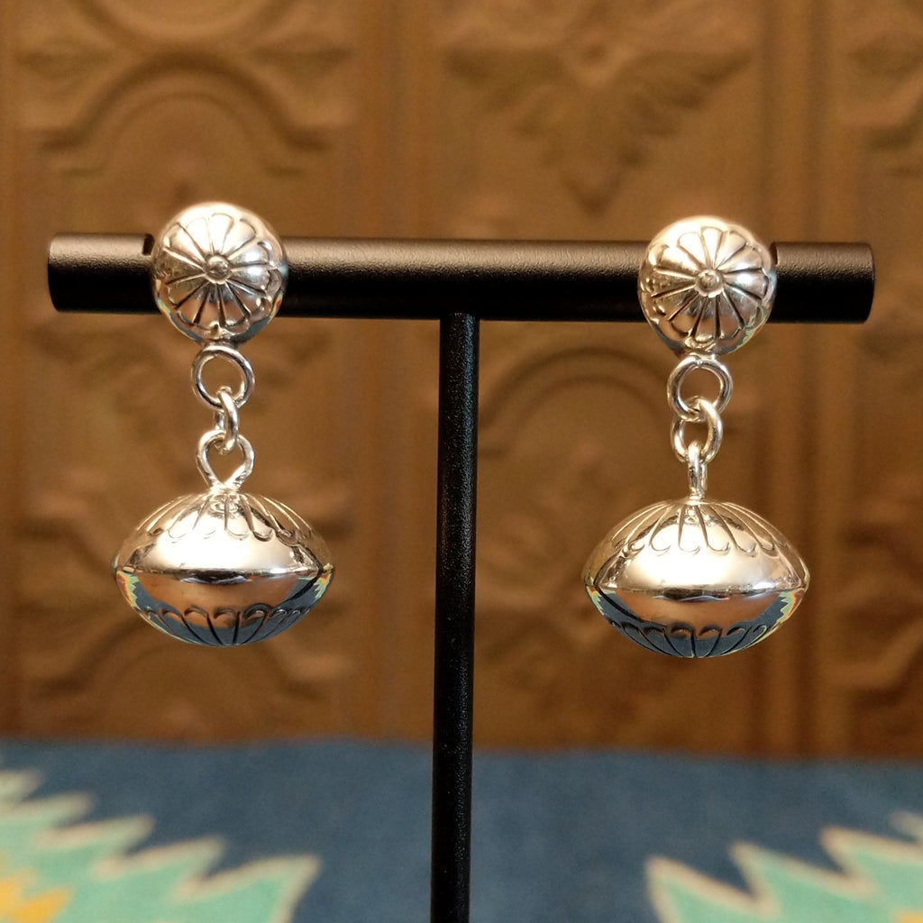 Dangle earrings with stud floral accents and chain.