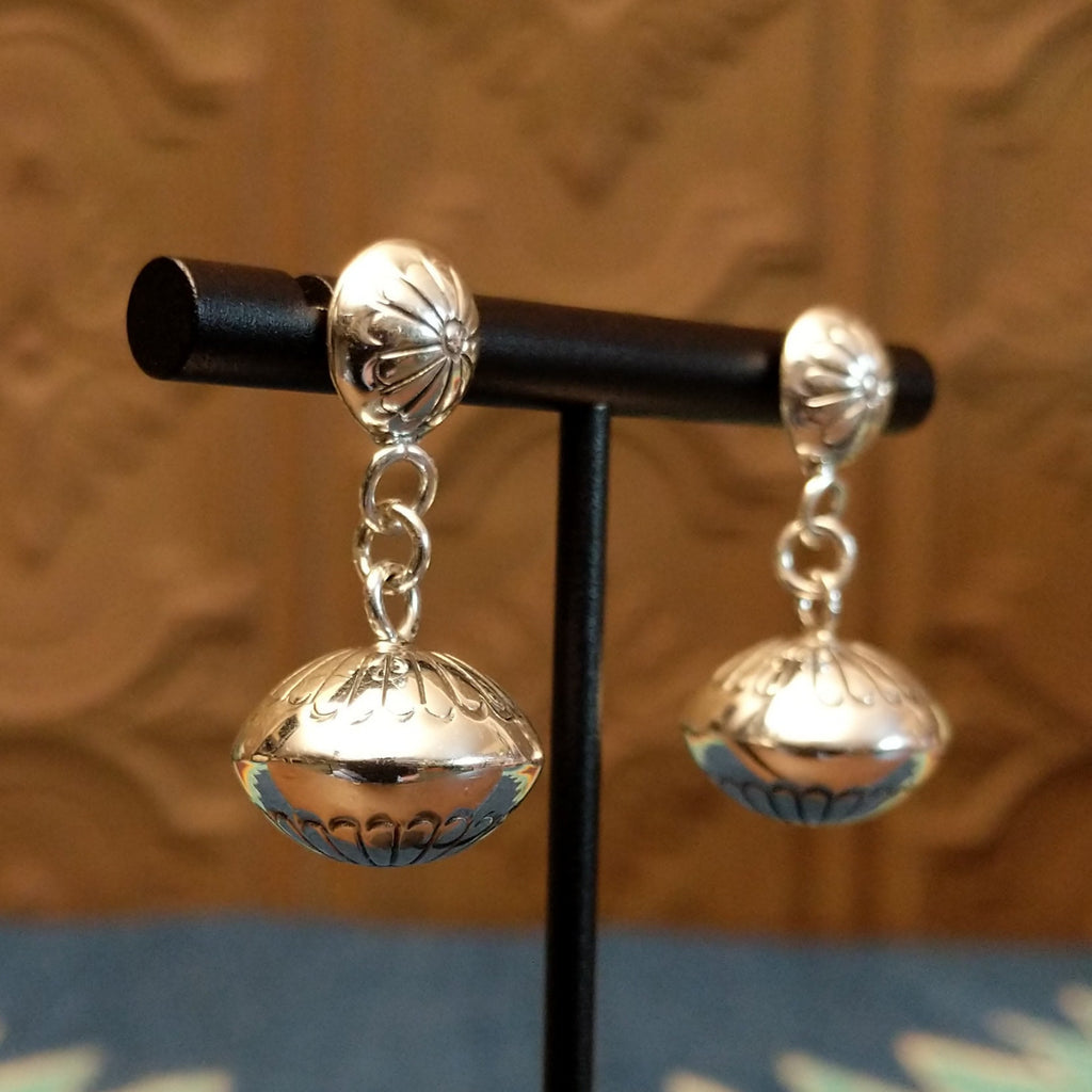 Dangle earrings with stud floral accents and chain.