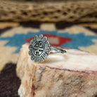 Navajo silver Sunface ring, featuring a handcrafted sterling silver Sunface design with intricate detailing and traditional Southwestern craftsmanship.  Side  view.