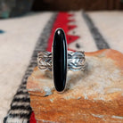 Navajo silver ring with long black onyx and detailed silver band.