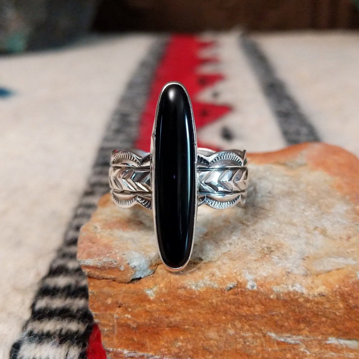 Navajo silver ring with long black onyx and detailed silver band.