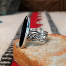 Navajo silver ring with long black onyx and detailed silver band.