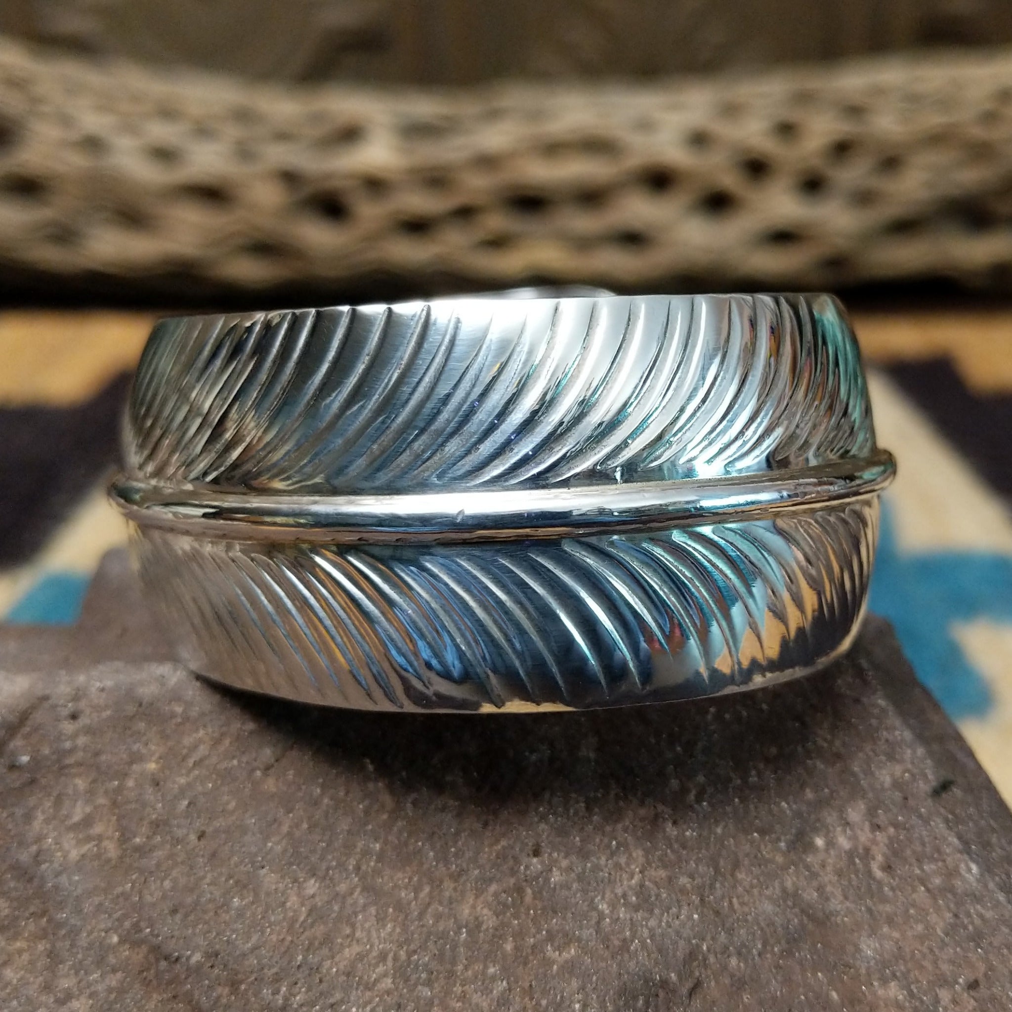 Navajo smooth silver feather cuff by A.D., featuring a handcrafted sterling silver feather design with polished contours and traditional Southwestern craftsmanship.