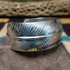 Navajo smooth silver feather cuff by A.D., featuring a handcrafted sterling silver feather design with polished contours and traditional Southwestern craftsmanship.