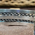 Navajo Sonoran Gold turquoise cuff by H.R.M., featuring an oval blue and green Sonoran Gold turquoise stone with natural matrix set in a handcrafted sterling silver cuff with twisted chain accents; artisan and Sterling Silver stamp.