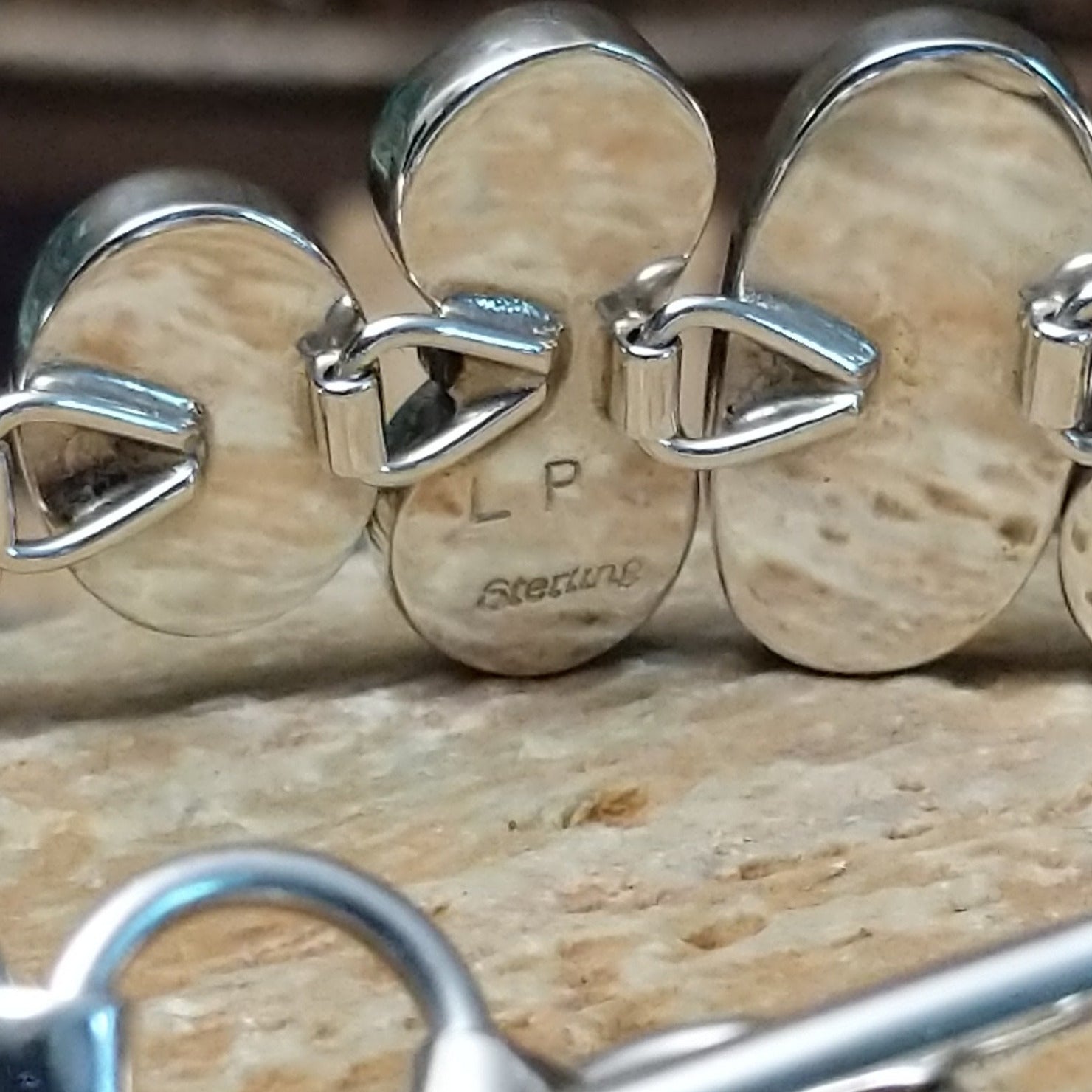 Close-up of the artisan's stamped signature.