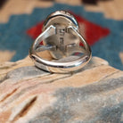 Sterling silver ring with Sonoran gold turquoise set in an oval, shadowbox setting.