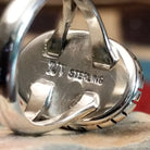 Close-up of the artisan's stamped signature.
