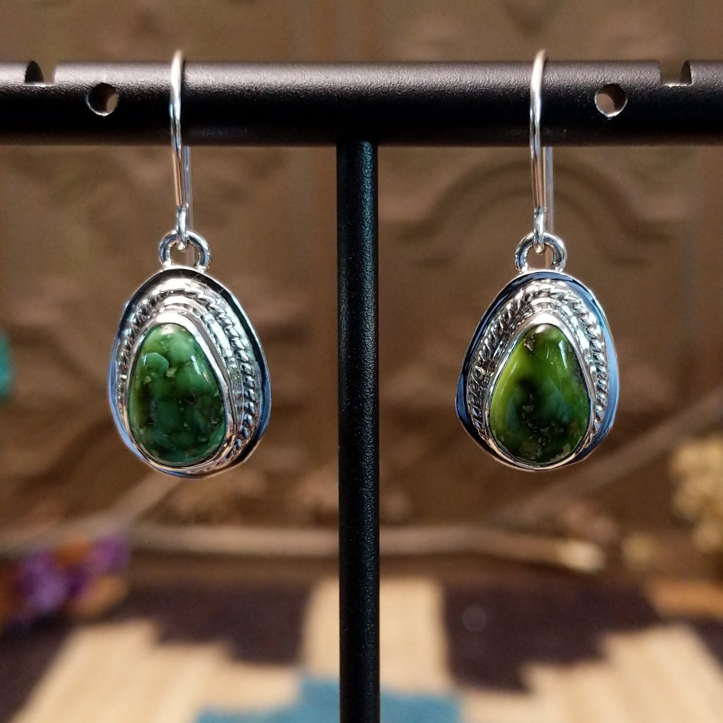 Sterling silver earrings with Sonoran gold turquoise set in teardrop bezels, framed by twisted rope accents.