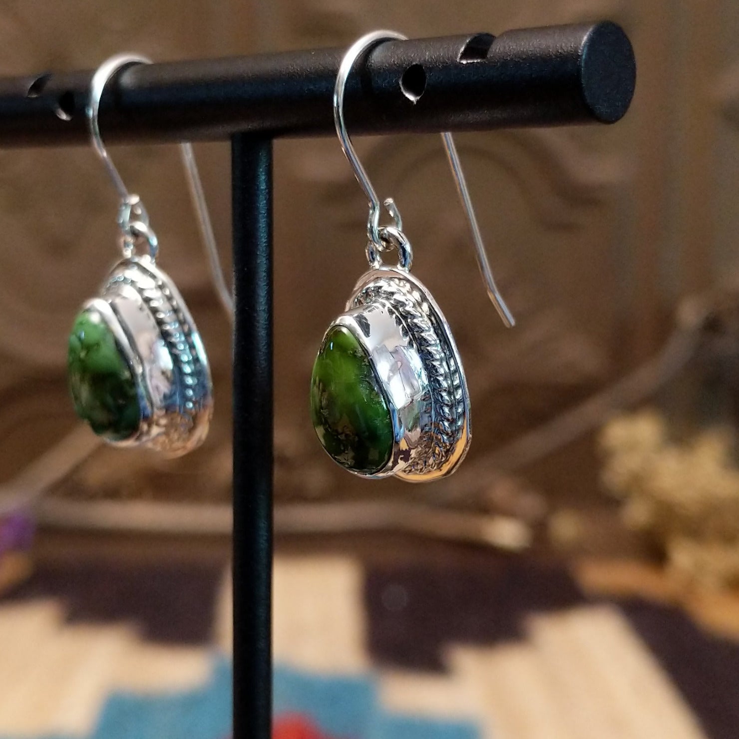 Sterling silver earrings with Sonoran gold turquoise set in teardrop bezels, framed by twisted rope accents.