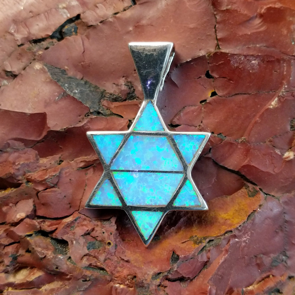 Sterling silver Star of David pendant with blue manmade opal inlaid.