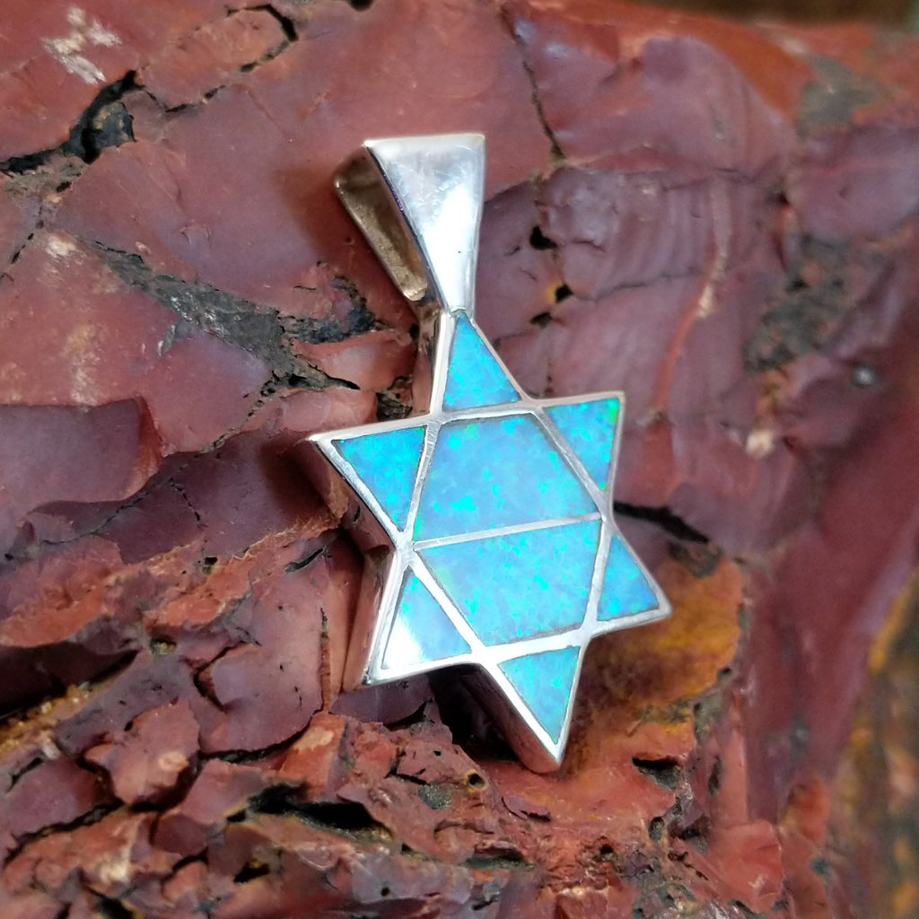 Sterling silver Star of David pendant with blue manmade opal inlaid.