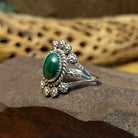 Navajo Starry malachite ring, featuring a vibrant green malachite stone with natural banding set in a handcrafted sterling silver band with Southwestern-inspired metalwork.  Side view.