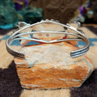 Navajo Starry White Buffalo cuff, featuring a white buffalo stone with bold black matrix patterns set in handcrafted Southwestern-inspired metalwork.  Underside view.