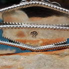 Navajo Starry White Buffalo cuff, featuring a white buffalo stone with bold black matrix patterns set in handcrafted Southwestern-inspired metalwork.  Artisan and .925 Silver stamp.