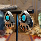 Sterling silver shadowbox earrings with turquoise set in notched bezels.