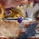 Thin sterling silver cuff with sugilite set in the bezel.