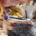 Thin sterling silver cuff with sugilite set in the bezel.