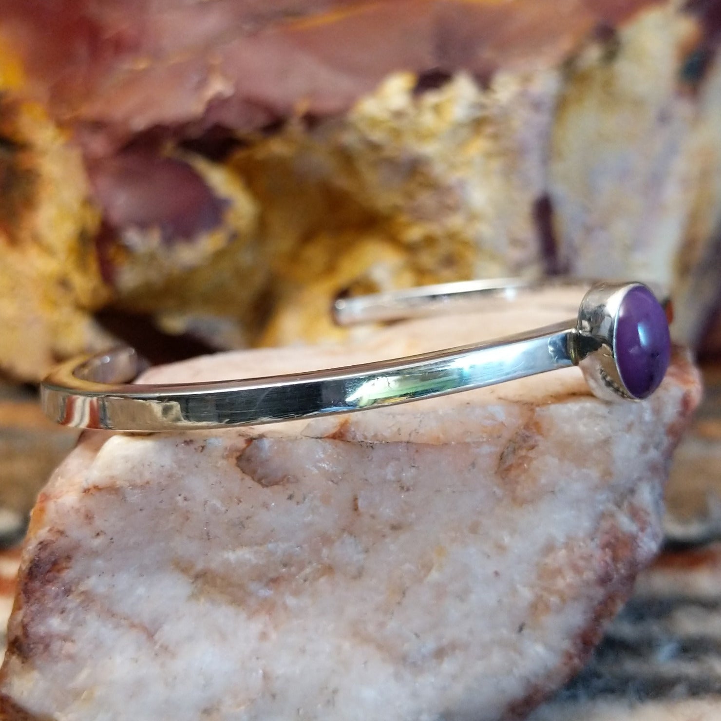 Thin sterling silver cuff with sugilite set in the bezel.