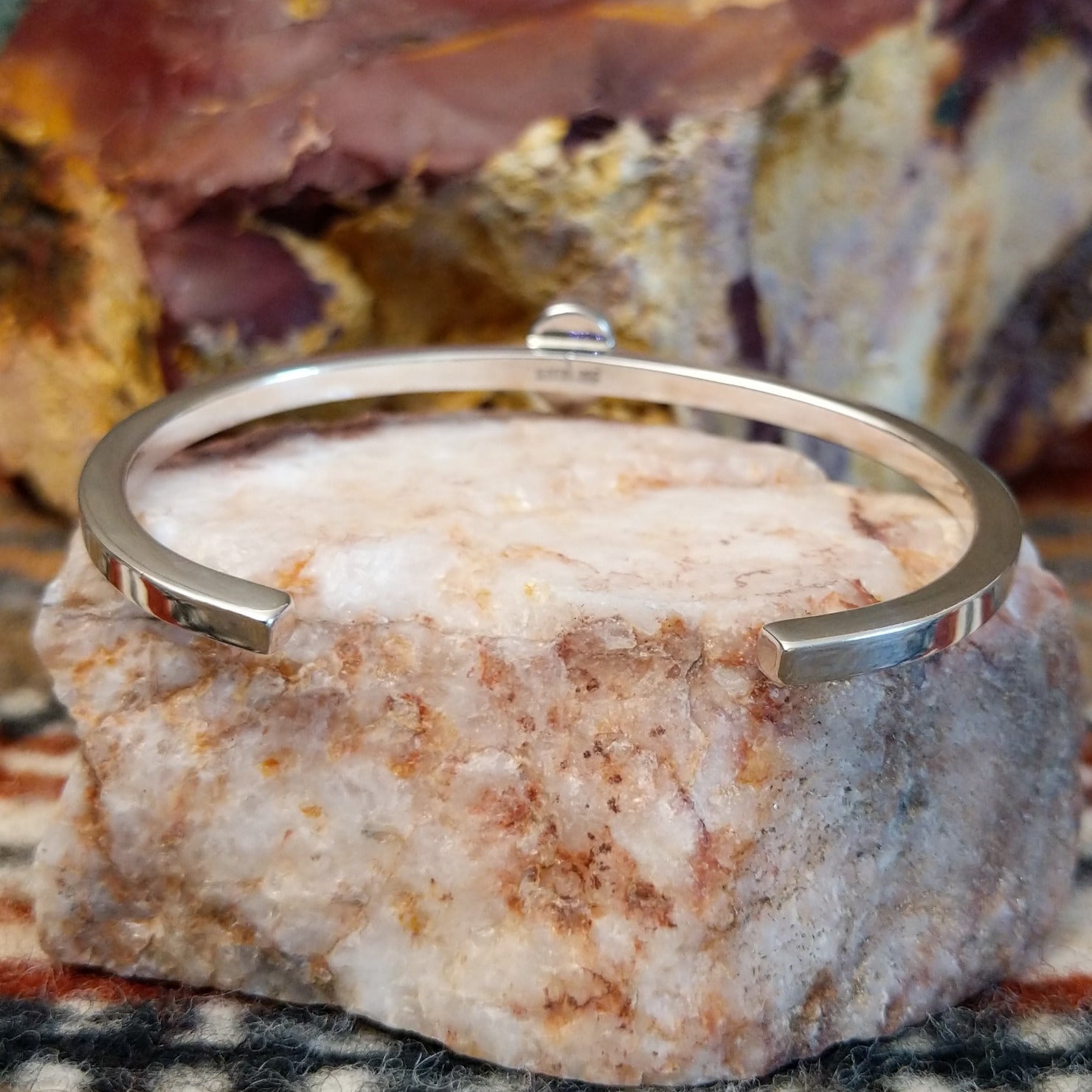 Thin sterling silver cuff with sugilite set in the bezel.