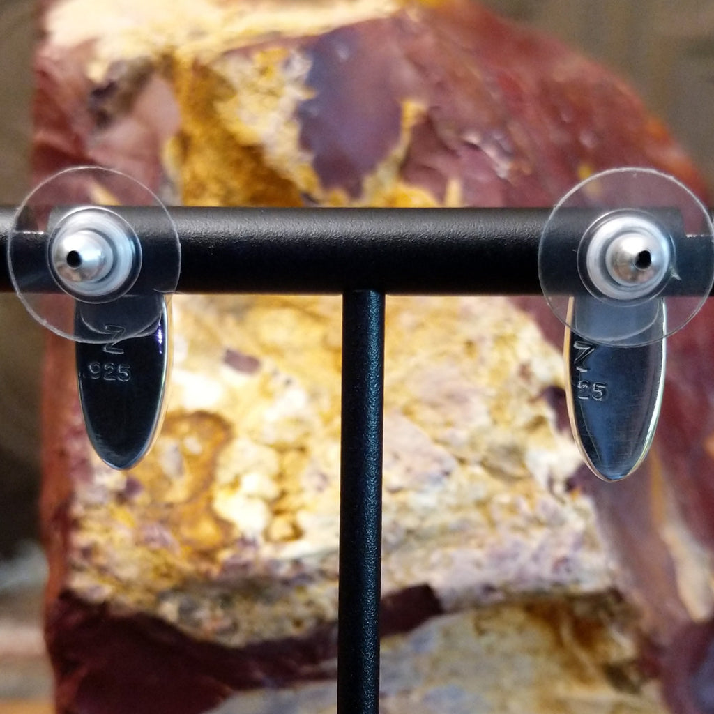 The authentication stamp is found on the backings.