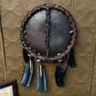 The back features the ties of the dark leather.