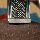 Navajo suspended sterling silver cuff, featuring layered twisted rope and polished silver strands in a handcrafted open cuff design with traditional Southwestern craftsmanship.  Sterling Silver stamp.