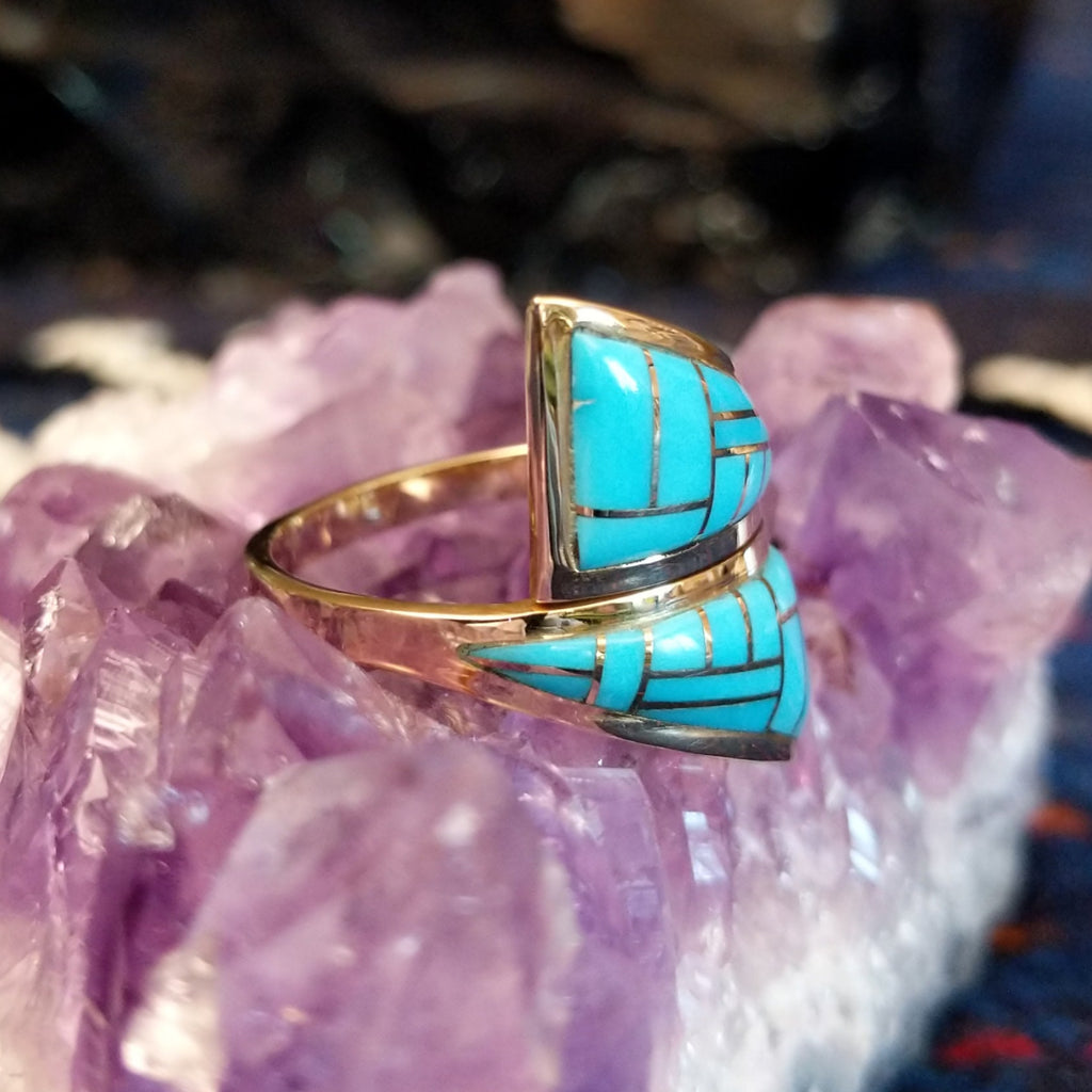 Side angle highlighting the split bandand raised turquoise mosaic inlays.