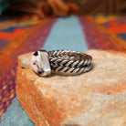 Navajo silver ring with triangular White Buffalo stone and double twisted band.
