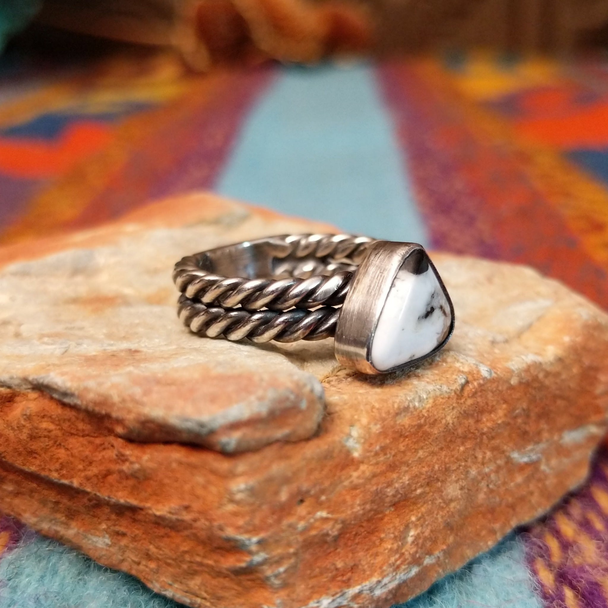 Navajo silver ring with triangular White Buffalo stone and double twisted band.