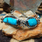 Navajo turquoise link bracelet by A.P. with natural turquoise stones set in handcrafted sterling silver.
