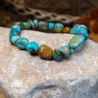 Bracelet with turquoise beaded along the elastic band.