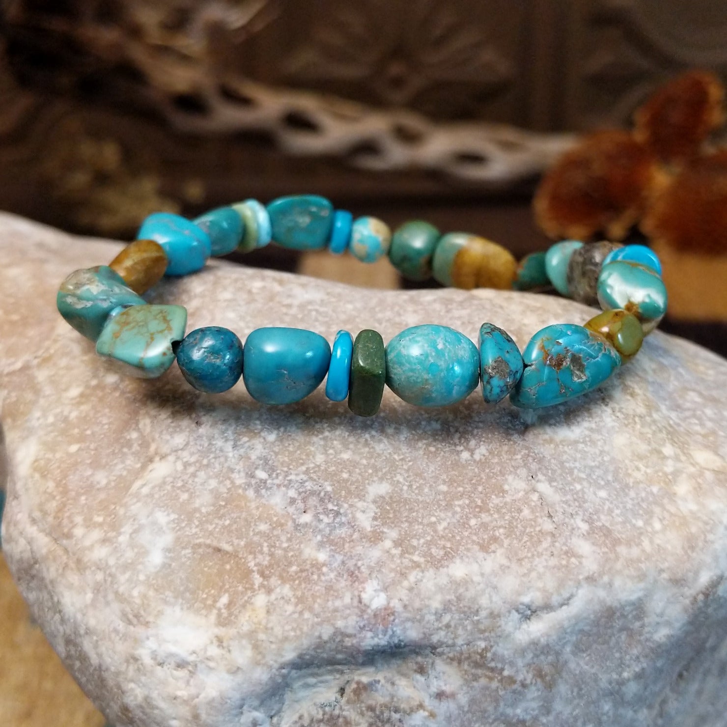Bracelet with turquoise beaded along the elastic band.