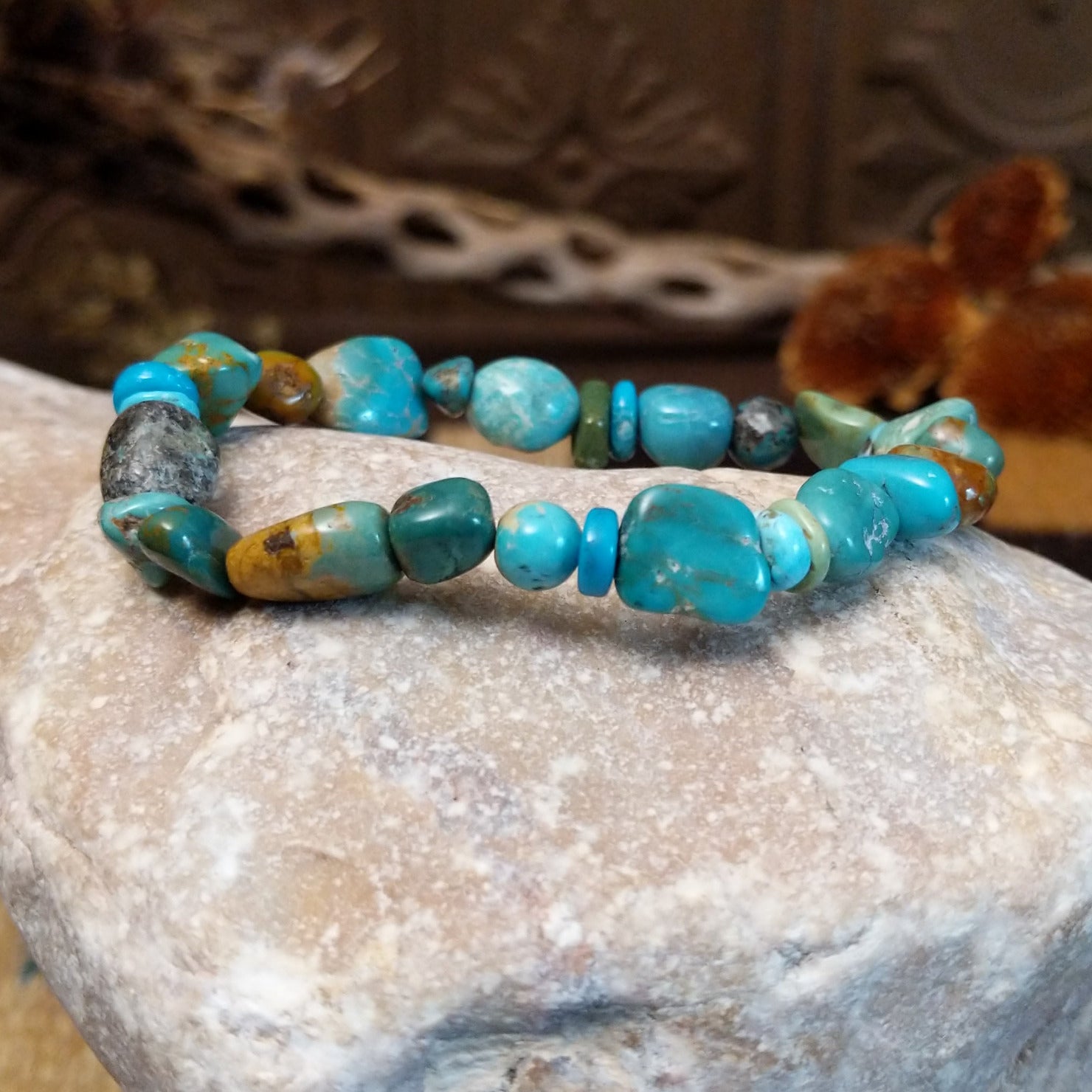 Bracelet with turquoise beaded along the elastic band.