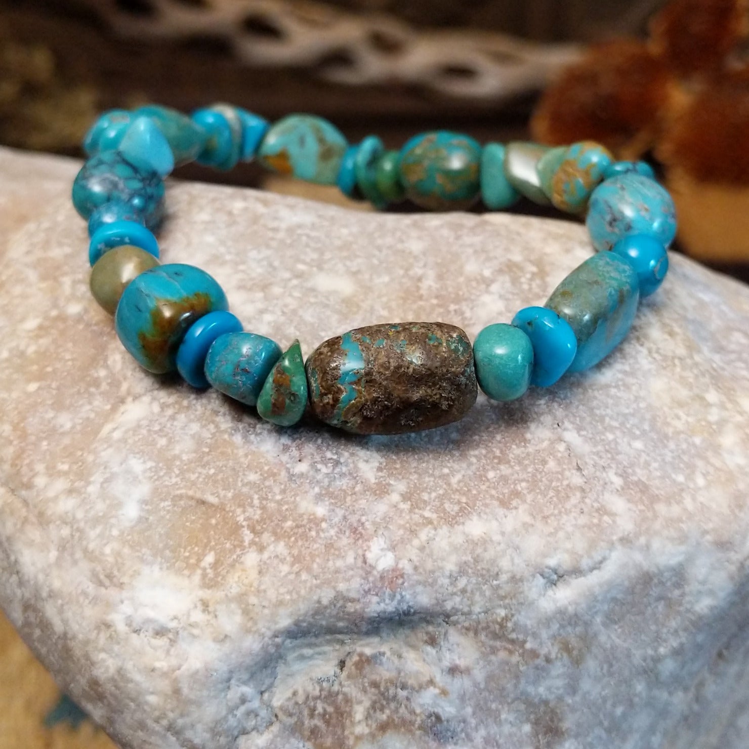 Bracelet with turquoise beaded along the elastic band.